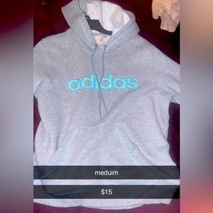 grey hoodie with blue writing